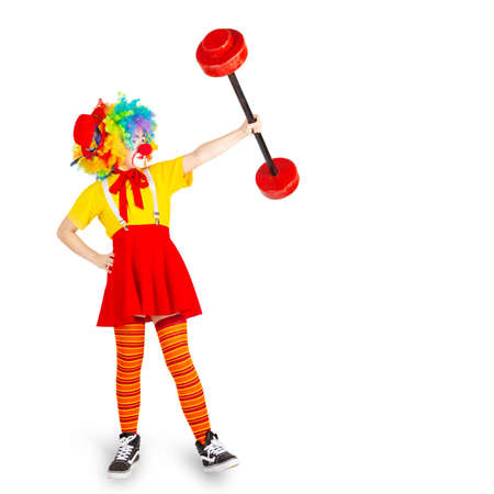 children in colorful clown outfits, isolated on a white backgroundの写真素材