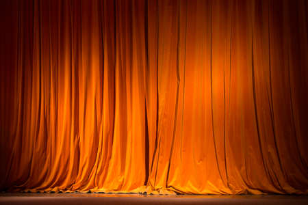 red-brown curtain on the stage with wooden floor and theater backstage, background, textureの写真素材