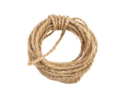 packing rope made of jute with a tied bow, isolate for clipping on a white backgroundの写真素材