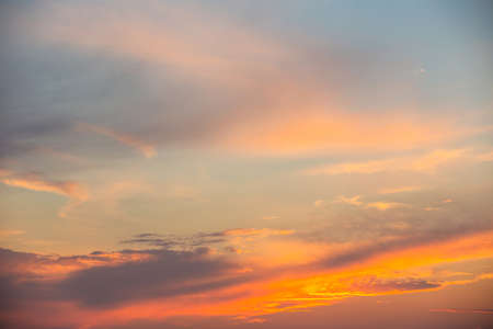 evening sky with clouds and rays of the sun, background