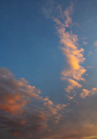 summer evening, sunset in yellow, orange and pink with clouds, background