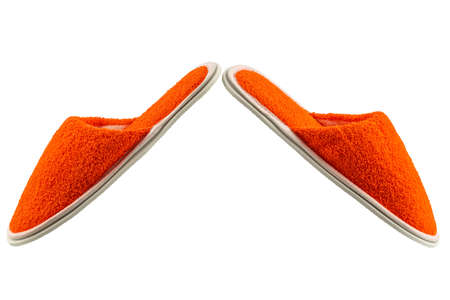 orange terry bath slippers isolated on a white backgroundの写真素材