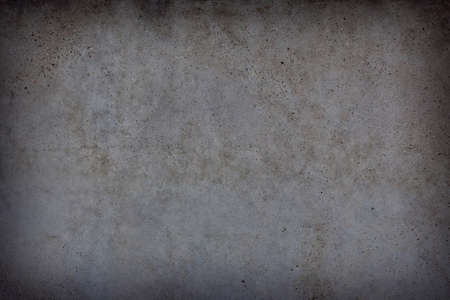 fragment of an old brick wall with concrete plaster and remnants of multicolored paint, grunge,...