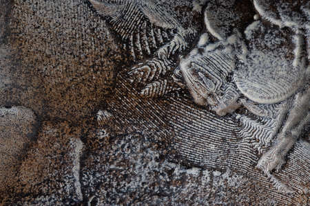 decorative wall finishing putty with fragments of paint, texture, backgroundの写真素材