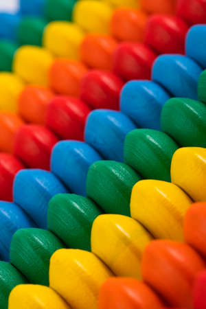 children's toy wooden abacus with multicolored knuckles, isolated on a white backgroundの写真素材