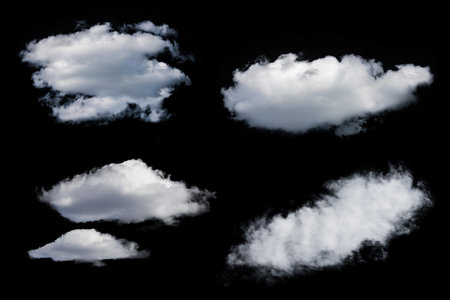 white fluffy clouds isolated on a black background, clipartの写真素材