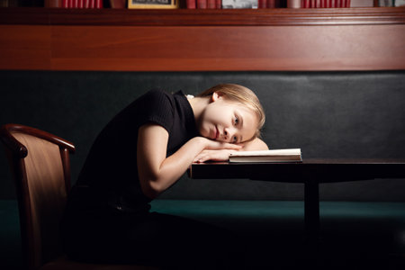 young people read a book in the library, self-study, leisure activities, schoolの写真素材