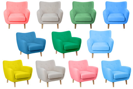 wide yellow upholstered armchair with fabric upholstery on wooden legs in retro style, isolated on a white backgroundの写真素材