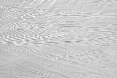 white packaging film with folds and wrinkles, abstract backgroundの写真素材