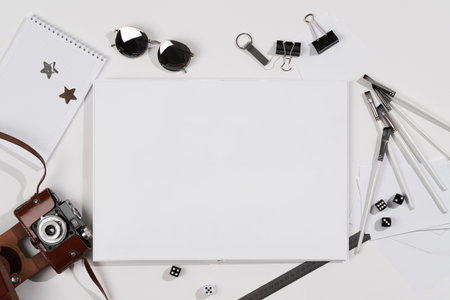 layout on a white table, mockup book with a clean spread and stationery, school background