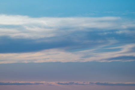 evening sky with clouds and rays of the sun, background