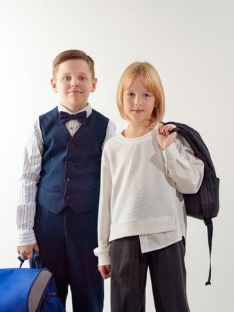 A boy and a girl on the set in the studio for a school album