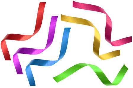 satin ribbon, twisted on a table, isolated on a white backgroundの写真素材