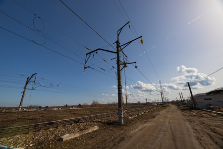 Section of railway track with road signs and bridgeの写真素材