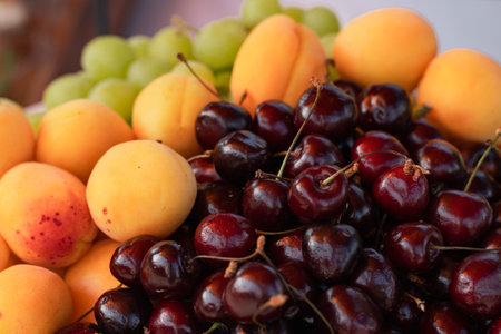 cherries, cherries and fresh apricots on the buffet table, weddingの写真素材
