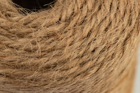 packing rope made of jute with a tied bow, isolated for clipping on a white background