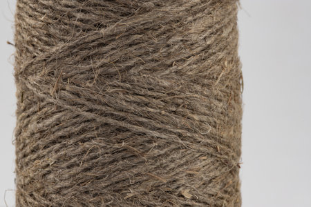 packing rope made of jute with a tied bow, isolated for clipping on a white background
