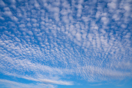 summer evening, sunset in yellow, orange and pink with clouds, backgroundの写真素材