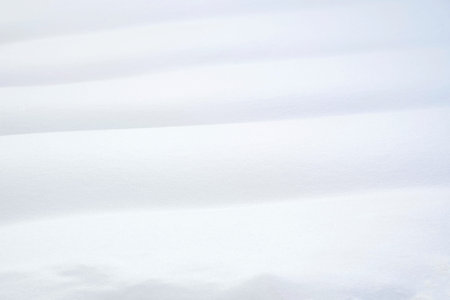 white snowdrift with blue shadows, winter textureの写真素材