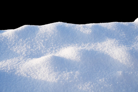 white snowdrift with blue shadows, winter textureの写真素材