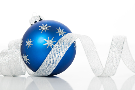 Blue xmas ball and silver ribbon on white background. Merry christmas!の写真素材