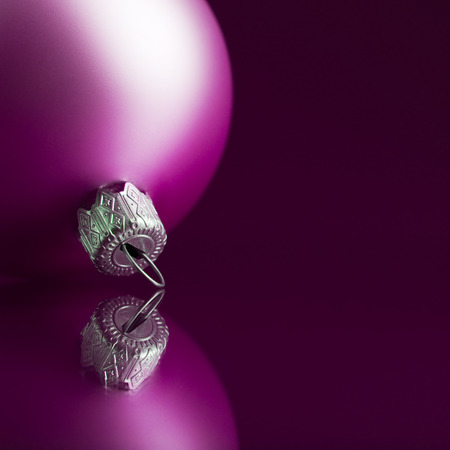 Purple xmas ball on dark backgroundの写真素材