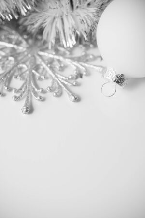 White xmas ornaments on white background with space for textの写真素材