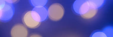 Banner made with the blurred lights of the garlands are blue and yellow. Light Blue bokeh...