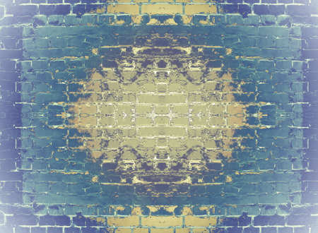 Ornament in blue and yellow tones on a brick wall.
