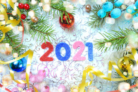 Christmas decorations, fir,  2021 new year numbers and festive bokeh lights