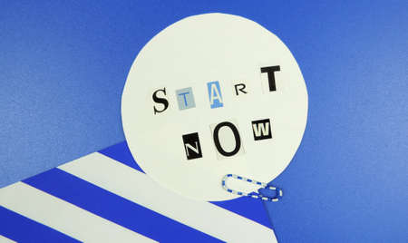 cut paper letters and inscription Start now, blue striped background
