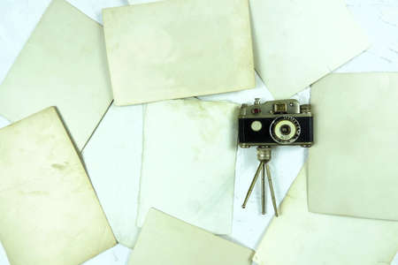 flat lay   vintage retro camera and old photos back side  , copy space