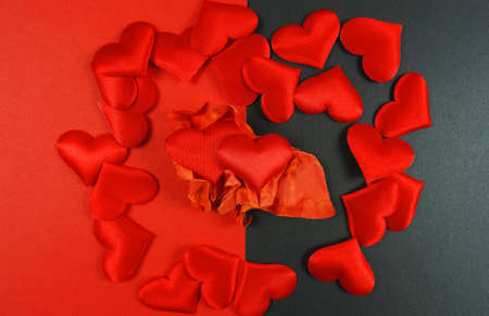 Valentines day concept. Romantic backgound, red hearts on red black background, copy space