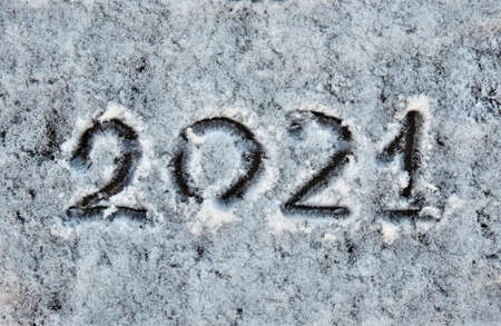 numbers 2021 painted in snow New Year holidays greeting card