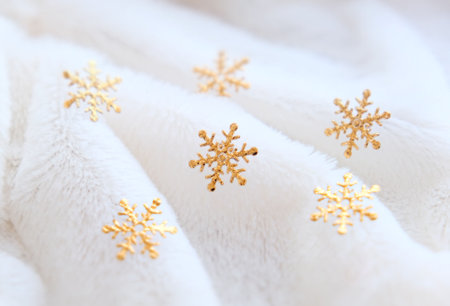 blurred christmas background with white fur and golden snowflake