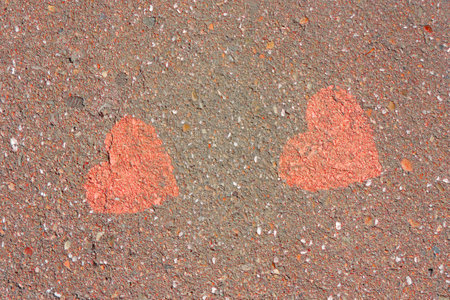 two hearts painted on the asphaltの写真素材