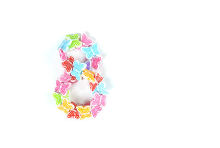 number eight from colored decorative butterflies on a white background