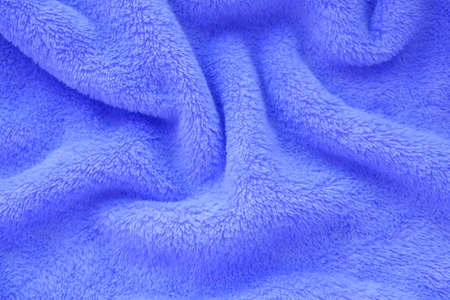 Selective focus . light and shadow on purple blue delicate background of nice furry cloth. Soft...