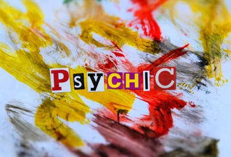 Word writing text Psychic from cut letters on abstract strokes bright colorful background. Headline, card of psychology. Psychologic concept.の写真素材