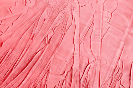 Pink abstract texture of surface covered with putty. Grain and noise effect. Wall background covered...