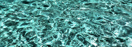 Close-up photo of sea wave, incredible color of ocean clear water, beautiful natural background of...