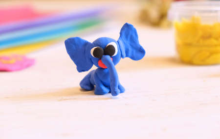 Home Education game with clay. Child made funny elephant from colorful plasticine, Early development concept. Educational and entertaining classes with childrenの写真素材