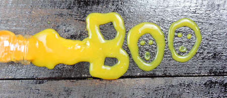 Boo  word from orange slime .    Halloween autumn holiday concept
