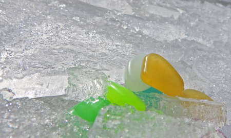 decorative colorful small elements on snow and ice. round shape colored elements