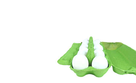 open egg box. chicken eggs in a green cardboard box on a white background, copy space