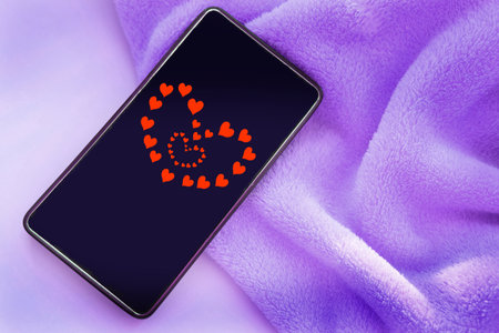 Smartphone screen with red hearts. youth culture. love, connection, dating conceptの写真素材
