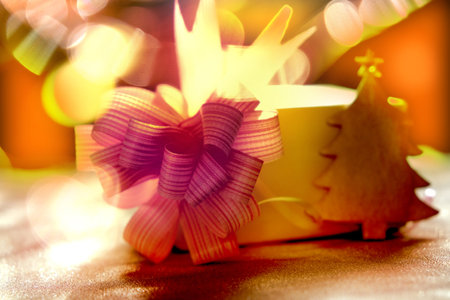 Fairy Christmas composition. Gift box and knick knack and bokeh lights background. Christmas, New Year, winter holiday concept.の写真素材