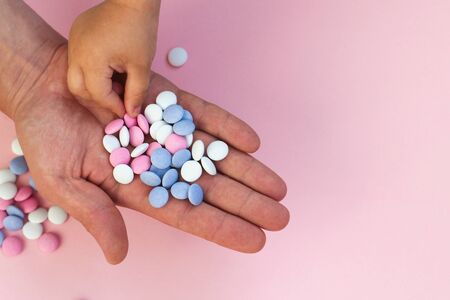 adult treats candy child. sweets pink, blue, whiteの写真素材
