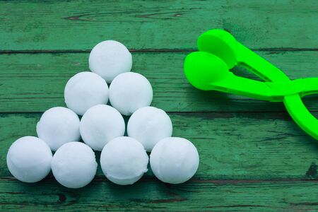 snowballs made with the help of a snowdrop. isolate on white background. the view from the top. entertainment with friends and children on the street in winter.A tool for modeling snowballs.の写真素材