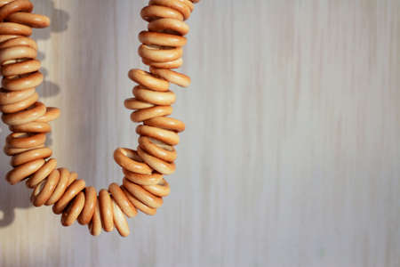 Drying bagels hanging on a twine. Traditional russian bakery.の写真素材
